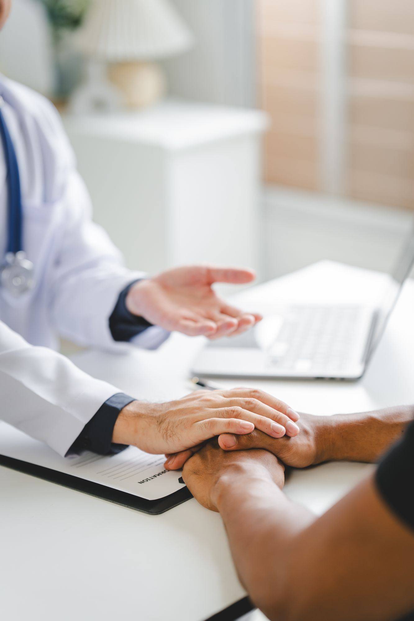 Direct primary care physician greeting a patient at check-in