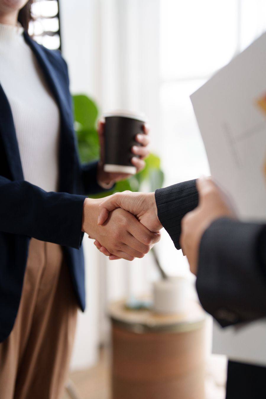Advisors shaking hands after a planning meeting