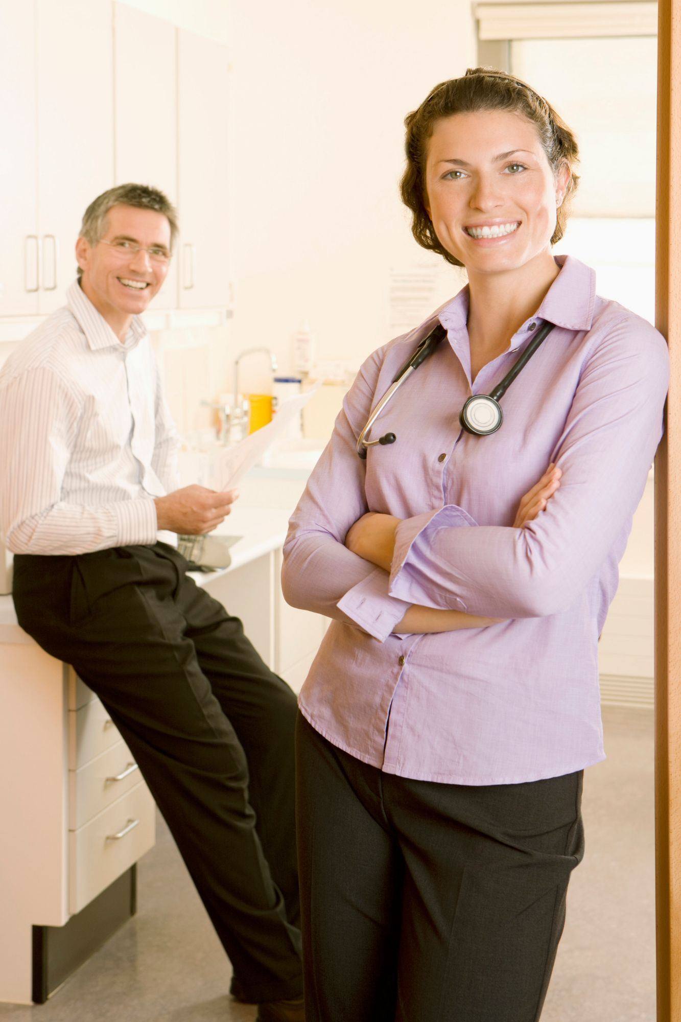 Longevity clinic providers consulting in an exam room