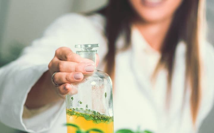 Naturopathic practitioner preparing an herbal tincture