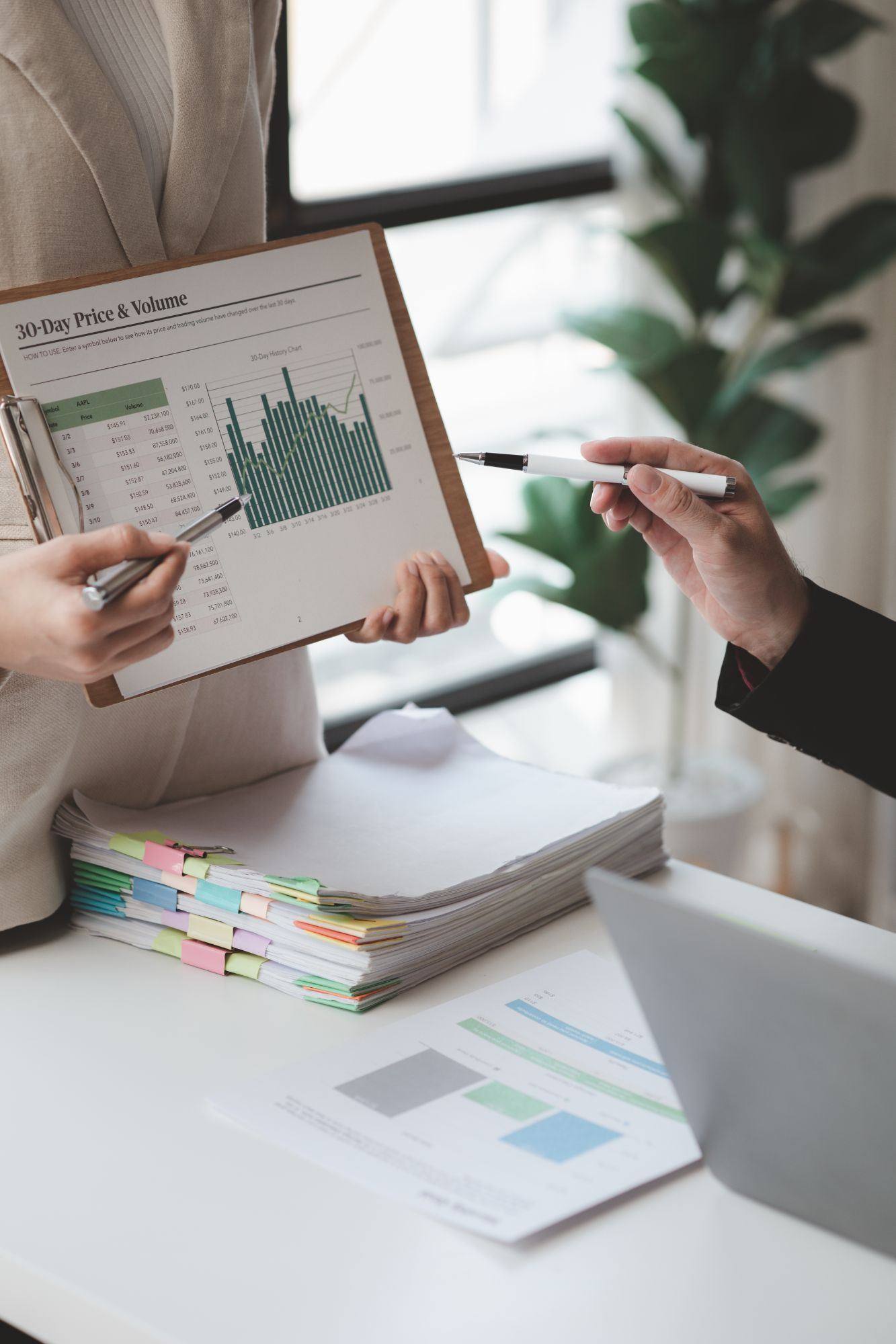 Reviewing performance data together during a client meeting