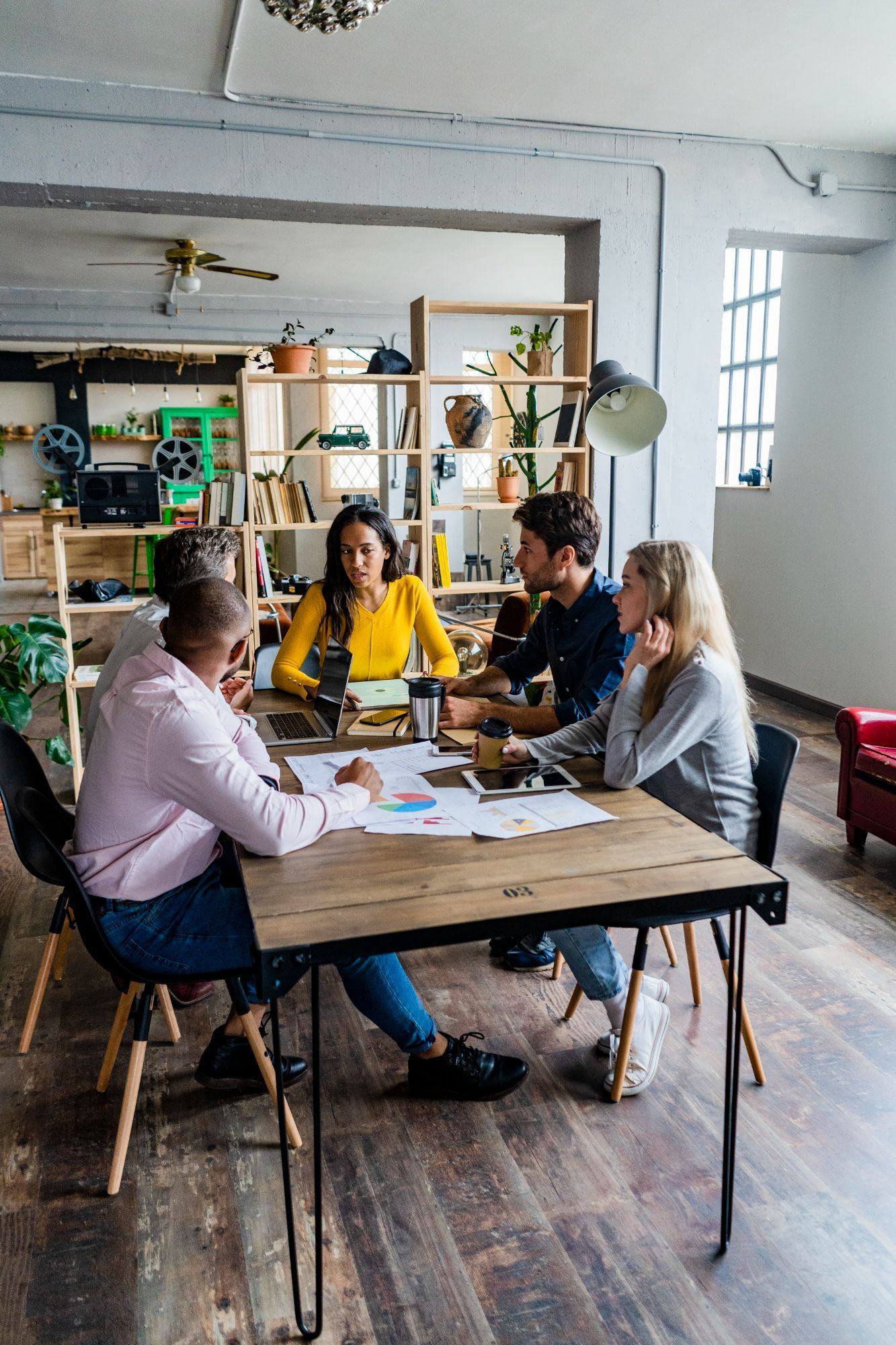 Business team meeting around a table to review financials
